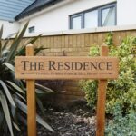 Free-standing-house-sign-on-wooden-posts