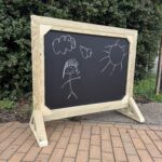 Free standing outdoor wooden chalk board for schools for EYFS learning. Made in Kent by Snobs Signs.