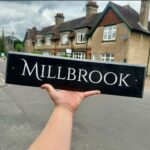 Long house name sign with bevelled edges, handmade in Kent by Snobs Signs.