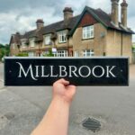 Long slate house name sign made in Kent by Snobs Signs. The slate sign is dark in colour; often being referred to as 'black slate'. The long house name is engraved deep into the surface of the slate. The lettering has then been hand painted in white to create a beautiful contrast between the house name and the slate.