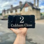 Slate house signs handmade in Kent by Snobs Signs. Address nameplates with deep engraved house number and street name.